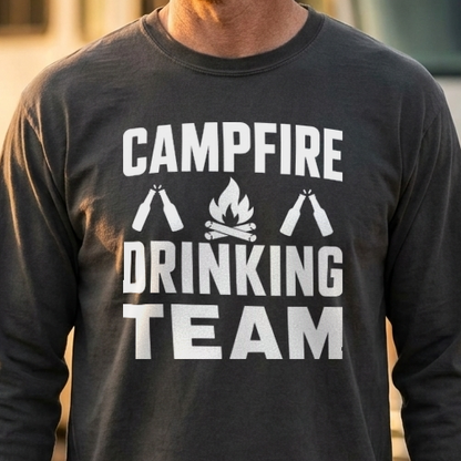 Close-up of a charcoal gray long sleeve shirt with a white Campfire Drinking Team design of a campfire and two clinking bottles